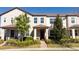 Charming townhome featuring well-maintained landscaping, a welcoming front porch, and neutral exterior paint at 9513 Amber Chestnut Way, Winter Garden, FL 34787