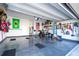 Spacious two car garage with epoxy flooring, overhead lighting, and ample shelving for optimal storage at 9513 Amber Chestnut Way, Winter Garden, FL 34787