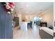 Bright, open concept interior with modern tile flooring, kitchen island, and dining area perfect for entertaining at 9513 Amber Chestnut Way, Winter Garden, FL 34787