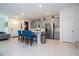 Stylish kitchen with gray cabinetry, stainless steel appliances, island seating, and a convenient coffee bar at 9513 Amber Chestnut Way, Winter Garden, FL 34787