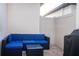 Cozy outdoor patio with blue cushioned wicker seating and brick pavers at 9513 Amber Chestnut Way, Winter Garden, FL 34787