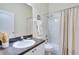 Bathroom featuring a single sink vanity with neutral tile backsplash and a shower-tub combination at 1019 Tuscan Hills Blvd, Davenport, FL 33897