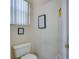 Powder room showing a toilet and informational posters on the neutral wall at 1019 Tuscan Hills Blvd, Davenport, FL 33897