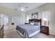 Bedroom showcasing neutral walls and carpet flooring, ceiling fan, and a walk-in closet at 1019 Tuscan Hills Blvd, Davenport, FL 33897