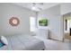 Bedroom featuring a ceiling fan, mounted television, dresser, and a window for natural light and comfort at 1019 Tuscan Hills Blvd, Davenport, FL 33897