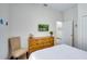 Bedroom with a dresser, chair, wall mounted television, and neutral colored walls at 1019 Tuscan Hills Blvd, Davenport, FL 33897