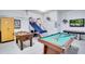 Entertaining game room with a pool table, foosball table, and basketball game, perfect for recreation at 1019 Tuscan Hills Blvd, Davenport, FL 33897