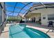 Enjoy the spacious screened-in pool area, ideal for entertaining and relaxation, with ample lounging space at 1019 Tuscan Hills Blvd, Davenport, FL 33897