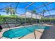 This screened-in pool area, enhanced with a spa, creates a private retreat for relaxation and enjoyment at 1019 Tuscan Hills Blvd, Davenport, FL 33897