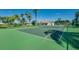 A well-maintained community tennis court offers residents a space for recreation and exercise under a blue sky at 1019 Tuscan Hills Blvd, Davenport, FL 33897