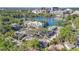 Aerial view showcasing the property's proximity to the lake, lush trees, and the downtown skyline at 1100 Delaney Ave # E13, Orlando, FL 32806