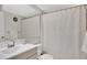 Bathroom features tile flooring, white vanity and shower-tub combo at 1100 Delaney Ave # E13, Orlando, FL 32806