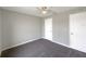 Neutral bedroom featuring carpet flooring and two large closets at 1172 Moyle Way, Mascotte, FL 34753