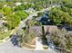 Aerial view of a charming single-Gathering home, featuring well-maintained landscaping and a spacious driveway at 134 Woodleaf Dr, Winter Springs, FL 32708