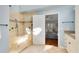 Bathroom showcasing a spacious walk-in shower with a glass door and updated fixtures at 134 Woodleaf Dr, Winter Springs, FL 32708