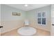 Bright Bedroom featuring a neutral color palette, modern fan, and natural light at 134 Woodleaf Dr, Winter Springs, FL 32708