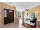 Inviting foyer with a beautiful front door, views into the living room, and tile flooring at 134 Woodleaf Dr, Winter Springs, FL 32708