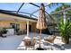 Screened in patio featuring stylish furniture and peaceful view at 134 Woodleaf Dr, Winter Springs, FL 32708