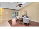 Sitting room featuring hardwood floors, a ceiling fan, and sliding glass doors to the patio at 134 Woodleaf Dr, Winter Springs, FL 32708