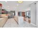 Bright, open kitchen featuring a large marble island and stainless steel appliances at 14815 Tullamore Loop, Winter Garden, FL 34787