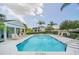 Community pool with ample lounge chairs and a cabana, perfect for enjoying sunny days in a relaxed setting at 14815 Tullamore Loop, Winter Garden, FL 34787