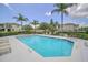 Community swimming pool surrounded by lounge chairs and well-manicured landscaping, ideal for relaxation and recreation at 14815 Tullamore Loop, Winter Garden, FL 34787