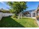 A well-maintained lawn with lush greenery, creating a peaceful outdoor space with a pool and covered patio at 221 Calliope St, Ocoee, FL 34761