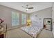 Cozy bedroom with wall mirror and blossoming floral wall art at 221 Calliope St, Ocoee, FL 34761