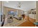 Open concept living room showcasing laminate floors, a ceiling fan, and lots of space at 221 Calliope St, Ocoee, FL 34761