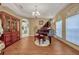 Elegant living room featuring laminate flooring, arched windows, and neutral paint colors at 221 Calliope St, Ocoee, FL 34761