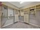 Well-organized walk-in closet with shelving, drawers, and ample storage space at 221 Calliope St, Ocoee, FL 34761