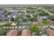 Overhead view of a community featuring a pool, tennis court, well-maintained lawns, and mature trees at 2471 Tahoe Cir # 00, Winter Park, FL 32792