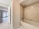 A tiled tub and shower at 2471 Tahoe Cir # 00, Winter Park, FL 32792