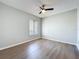 This bedroom features a window and ceiling fan at 2471 Tahoe Cir # 00, Winter Park, FL 32792