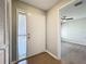 Bright foyer with white door, closet and views into the main living space with wood floors at 2471 Tahoe Cir # 00, Winter Park, FL 32792