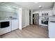 Kitchen featuring stainless steel appliances, refrigerator, and in-unit laundry area at 2471 Tahoe Cir # 00, Winter Park, FL 32792