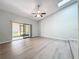 Bright living room featuring vaulted ceilings, sliding glass doors to the outside, and neutral tones at 2471 Tahoe Cir # 00, Winter Park, FL 32792