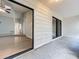 Covered patio with a glimpse of the living room through a sliding glass door showcasing light wood flooring at 2471 Tahoe Cir # 00, Winter Park, FL 32792