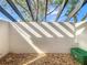 Private patio with a pergola roof creating patterned shade, perfect for outdoor relaxation and container gardening at 2471 Tahoe Cir # 00, Winter Park, FL 32792