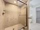 Tiled walk-in shower with a glass door at 2471 Tahoe Cir # 00, Winter Park, FL 32792