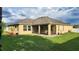 Well-kept backyard with screened-in porch, and lush green grass at 2749 Sand Oak Loop, Apopka, FL 32712
