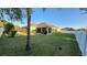 Home exterior with a well-maintained lawn and fenced-in yard at 2749 Sand Oak Loop, Apopka, FL 32712