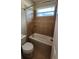 Bathroom with white tub, shower, and neutral tile with mosaic accents, complemented by a bright window at 2749 Sand Oak Loop, Apopka, FL 32712