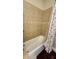 Clean bathtub with tiled walls and shower curtain, perfect for a relaxing bath at 2749 Sand Oak Loop, Apopka, FL 32712