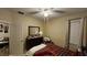 Bedroom featuring a dresser with a mirror and an overhead fan and light fixture at 2749 Sand Oak Loop, Apopka, FL 32712