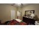 Bedroom showcasing a dresser with mirror, ceiling fan, and neutral-toned walls and carpet at 2749 Sand Oak Loop, Apopka, FL 32712