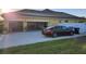 Home with spacious garage, driveway, and freshly cut lawn at 2749 Sand Oak Loop, Apopka, FL 32712