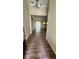 Open foyer showcasing wood-look tile flooring, high ceilings, and a view into the spacious living areas at 2749 Sand Oak Loop, Apopka, FL 32712