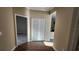 Hallway featuring tile flooring and a closet with double doors leading into adjoining rooms at 2749 Sand Oak Loop, Apopka, FL 32712
