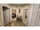 Hallway featuring tile floors, neutral walls, and multiple doorways leading to bedrooms and other areas at 2749 Sand Oak Loop, Apopka, FL 32712